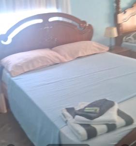 Giường trong phòng chung tại Kaza SZ