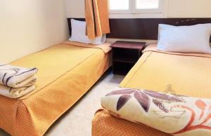 Postel nebo postele na pokoji v ubytování Hôtel Jodesa