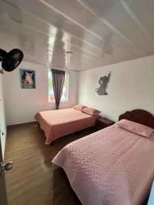 Giường trong phòng chung tại La Casa de Oliva