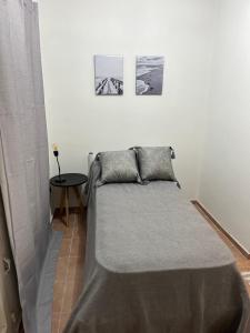 Ένα ή περισσότερα κρεβάτια σε δωμάτιο στο Apartamento 2 dormitorios, piscina, bicis, parrilla en corazon de maipu