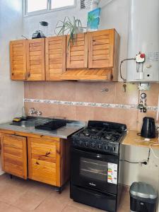 Η κουζίνα ή μικρή κουζίνα στο Apartamento 2 dormitorios, piscina, bicis, parrilla en corazon de maipu