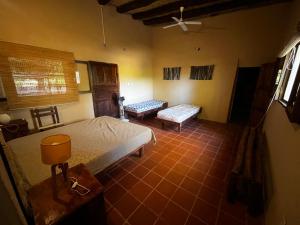 a bedroom with a bed and a couch in it at Finca Basin in Barreal