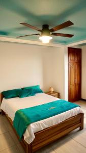 Ένα ή περισσότερα κρεβάτια σε δωμάτιο στο Cristo rey hostal campestre +8 φωτογραφίες