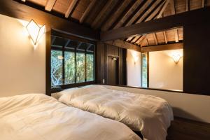 En eller flere senge i et værelse på COCO VILLA 伊豆赤沢-Izu Akazawa-