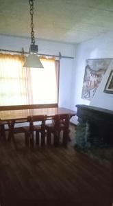 a living room with a table and a window at Lunita in Costa Azul