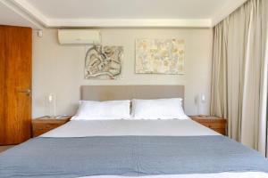 En eller flere senge i et værelse på Amanecer en Chacras + 12 billeder