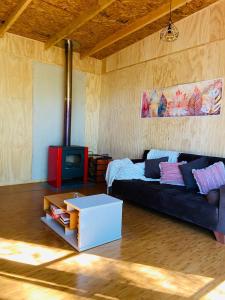 Giường trong phòng chung tại Cabañas con tinajas Mahuidas Panguipulli +19 ảnh