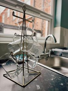 a glass holder on top of a kitchen counter at Rock Ferry home in Birkenhead