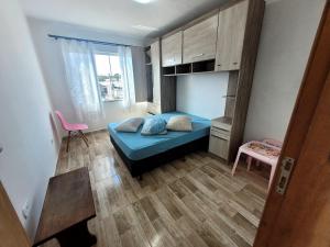 Ένα ή περισσότερα κρεβάτια σε δωμάτιο στο Praia de Leste Sobrado com piscina