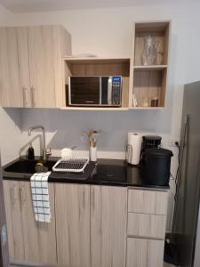 Η κουζίνα ή μικρή κουζίνα στο Loft vista 23 zona 10 parqueo balcón gym