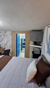 Ένα ή περισσότερα κρεβάτια σε δωμάτιο στο Nido de amor