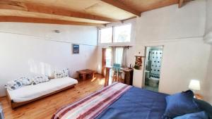 Ένα ή περισσότερα κρεβάτια σε δωμάτιο στο Campamento Ñandú Hostel