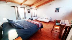 Ένα ή περισσότερα κρεβάτια σε δωμάτιο στο Campamento Ñandú Hostel +6 φωτογραφίες