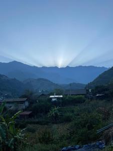 a view of a valley with mountains in the background at SaPa Farmer House in Sa Pa