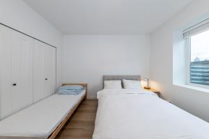 Ένα ή περισσότερα κρεβάτια σε δωμάτιο στο Sunflower Brandnew Cozy Private Suite