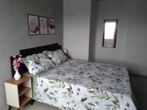 Ένα ή περισσότερα κρεβάτια σε δωμάτιο στο Suite da Ana