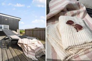 a blanket and a pair of sunglasses on a deck at 641-Hvide-Sande-Julianevej-13 in Bjerregård +28 photos