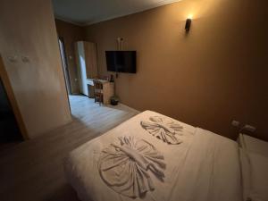 Giường trong phòng chung tại Hotel In the heart of Old Bazaar with private parking