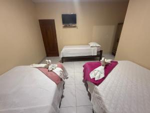 Ένα ή περισσότερα κρεβάτια σε δωμάτιο στο Caribe de Alter - Hotel & Pousada +92 φωτογραφίες