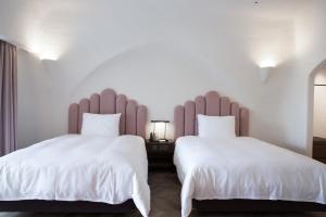 Ένα ή περισσότερα κρεβάτια σε δωμάτιο στο Ecoland Hotel