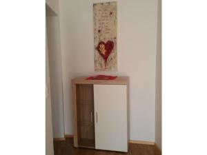 a room with a small table and a white wall at 4 Michael Weiß Comfortable holiday residence in Reinhartsmais