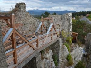 a wooden bridge on top of a stone building at 4 Michael Weiß Comfortable holiday residence in Reinhartsmais