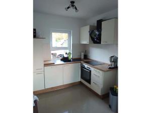 Kuchyň nebo kuchyňský kout v ubytování Tinla Comfortable Holiday Residence