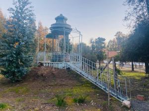 a gazebo with a tower in a park at Hacienda Ranguil in Lolol