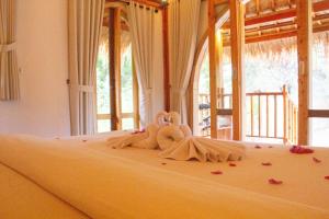 Ένα ή περισσότερα κρεβάτια σε δωμάτιο στο The Good House +8 φωτογραφίες