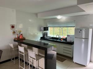 Η κουζίνα ή μικρή κουζίνα στο Refúgio Escarpas do Lago Mirante 1702