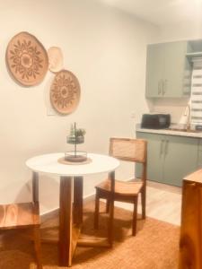 a table in a kitchen with a table and chairs at El descanso in Higuey