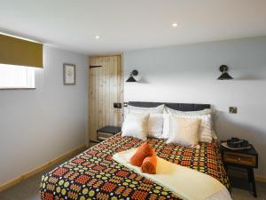 Ένα ή περισσότερα κρεβάτια σε δωμάτιο στο Cowlas