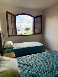 Postel nebo postele na pokoji v ubytování Iguaba Grande - Frente Lagoa - Centro