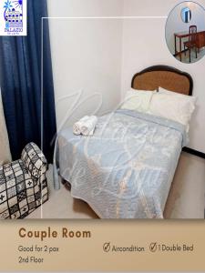 Giường trong phòng chung tại Palazio De Laiya Resort Hotel