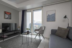 TV a/nebo společenská místnost v ubytování Pramea Apartments Asematalo + 9 fotografií