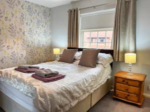 Postel nebo postele na pokoji v ubytování Rogue Cottage