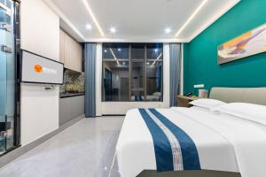 Kuchyň nebo kuchyňský kout v ubytování 桔迎酒店-广州动物园沙河顶地铁站店