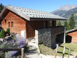 a building with a roof on top of it at Chalet in Villarodin near Lake in La Norma