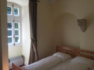 Ένα ή περισσότερα κρεβάτια σε δωμάτιο στο Apartment in Serrières with Alps View Pool +20 φωτογραφίες