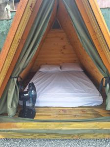 Ένα ή περισσότερα κρεβάτια σε δωμάτιο στο Cabanas Beach Maresias