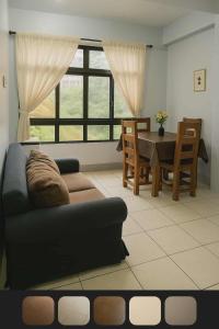 a living room with a couch and a table at Wow unit 2 for 6 guests up to 8 in Baguio