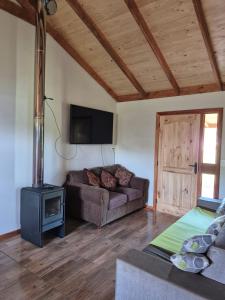 Una televisión o centro de entretenimiento en Cabaña Familiar