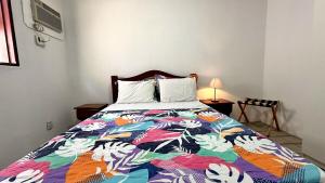 En eller flere senge i et værelse på Casa Adélia - Conforto e aconchego a Beira Mar + 33 billeder