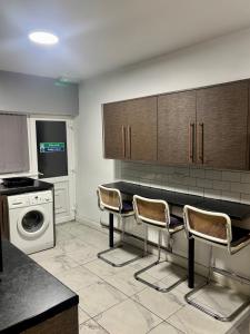 Kuchyň nebo kuchyňský kout v ubytování The Trio-Room