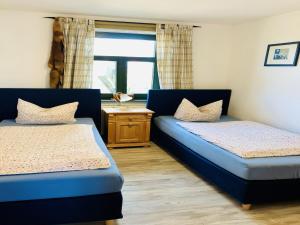 Ένα ή περισσότερα κρεβάτια σε δωμάτιο στο Idyllische Wohnung mit Pool in Mecklenburg +23 φωτογραφίες