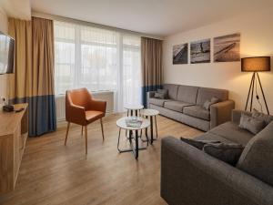 Χώρος καθιστικού στο Appartements im Freizeitpark Weissenhäuser Strand