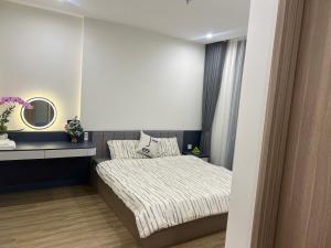Ένα ή περισσότερα κρεβάτια σε δωμάτιο στο Homestay Vinhomes Smart City