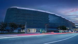 a large building with a road in front of it at Holiday Inn Wenzhou Airport by IHG in Wenzhou