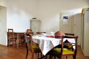 a dining room with a table and chairs at B&B Casa Carbonara in Cividale del Friuli