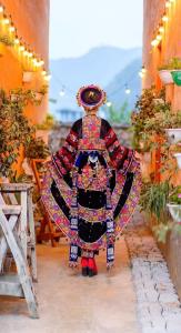 a statue of a person dressed in a costume at Mùa Pửi Lô lô homestay in Mèo Vạc